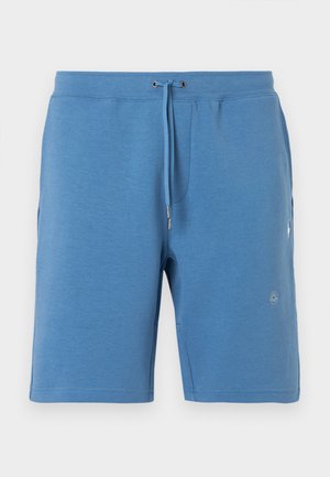 Sinised põlveni ulatuvad meeste dressipüksid, mille ees on taskud ja reguleeritav nöörvöökoht, eksponeeritud valgel taustal.