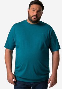 Türkisblaue T-Shirt mit kurzen Ärmeln und Rundhalsausschnitt, aus glattem Stoff gefertigt. Verfügt über ein dezentes Logo auf der Brust und einen lässigen Schnitt.