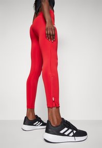 adidas Performance Tekaške pajkice - team power red