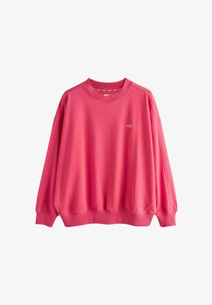 Knallpinker Pullover mit langen Ärmeln, gerippten Bündchen und Saum, Rundhalsausschnitt und kleinem weißen Schriftzug "self." auf der linken Brust.