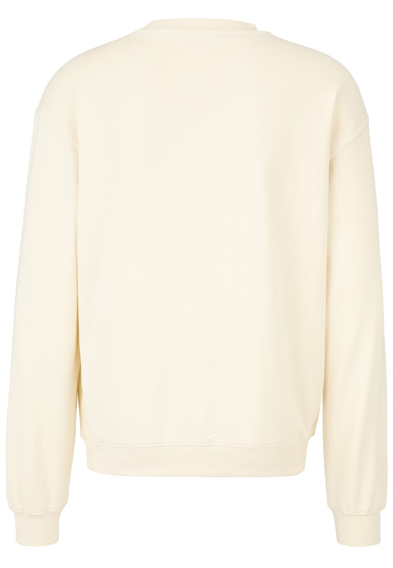 Felpa color crema, realizzata in tessuto morbido, con una vestibilità rilassata, collo rotondo e polsini e orlo a costine con texture liscia.