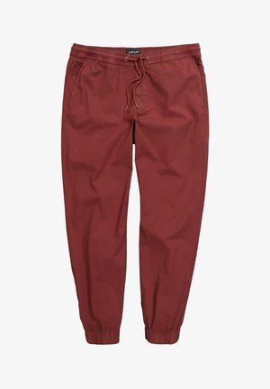 Pantaloni jogger da uomo color ruggine con vita elastica, coulisse, tasche laterali e polsini elastici alle caviglie.