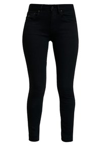 Jeans skinny negros de denim, con una cintura alta, bolsillos frontales y una textura suave con un diseño limpio y minimalista.