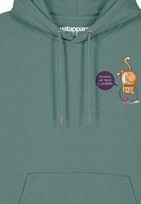 Teal hoodie met grote voorkantzak, zilveren oogjes en koordjes. Bevat een grafisch ontwerp van een kat met een spraakballon waarin staat: "Houston, we hebben een probleem."