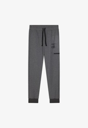 Pantalones deportivos gris oscuro con cordón negro, tobillos puños, un bolsillo lateral con cremallera y texto negro "Freddy elite" en el muslo.