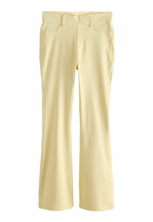 Heledates kollases toonis bootcut püksid esikäekottide ja vormitud vöökohaga, eksponeeritud sirgelt valgel taustal.