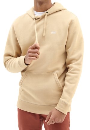 Beige hoodie met een voorzak, trekkoord en Vans-logo. Gemaakt van zachte stof met een ontspannen pasvorm en ribgebreide manchetten.