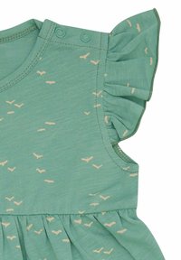 Abito verde con scollatura rotonda, spalla a volant e gonna arricciata. Presenta un motivo di piccole forme di uccelli beige.