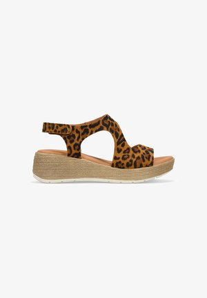 Sandalias de cuña con estampado de leopardo, parte superior de ante, punta abierta y correa ajustable en el tobillo. Suela texturizada con un detalle de diseño trenzado.