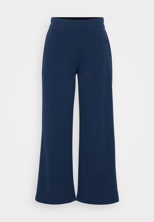 Marine wijde broek gemaakt van zachte, rekbare stof met een hoge tailleband. Voorzien van zijzakken en een ontspannen pasvorm voor comfort.