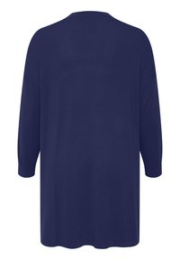 Mornarsko modra oversized bluza z dolgimi rokavi in okroglo vratno odprtino, ki je izdelana iz gladkega, teksturiranega materiala in ima ravno spodnji rob.