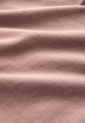 Textile fabric with a smooth texture, in a soft mauve color, featuring subtle diagonal weave patterns and gentle draping folds.