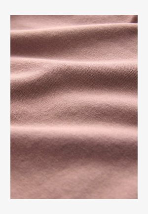 Textile fabric with a smooth texture, in a soft mauve color, featuring subtle diagonal weave patterns and gentle draping folds.