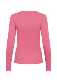 Langdurige shirt in levendig roze, gemaakt van ribbelstof, met een ronde halslijn en een fitted ontwerp. Geen zichtbare versieringen.