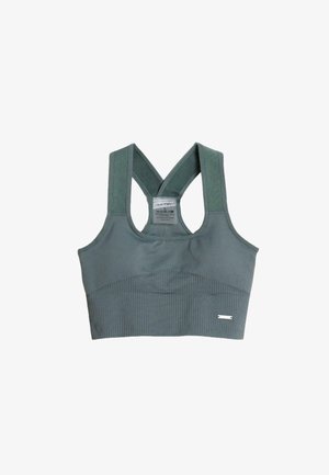 Sportinė liemenėlė muted žalsvos spalvos, su ruožuota tekstūra, plačiomis kryžminėmis petnešomis ir subtiliu logotipu priekinėje juostoje.