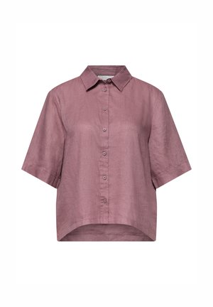 Chemise à manches courtes rose poudré avec boutons, col pointu et ourlet légèrement incurvé, fabriquée en tissu léger en lin.