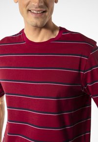 Red striped t-shirt with horizontal stripes in navy and white, featuring a crew neckline and short sleeves, made from a soft fabric.