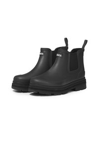 Bottines Chelsea noires en caoutchouc avec des panneaux élastiques sur les côtés, des languettes de tirage et une semelle épaisse pour une meilleure adhérence. Fini lisse, conçu pour les conditions humides.