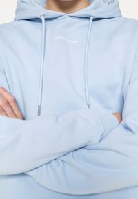 sandro Jersey con capucha - light blue
