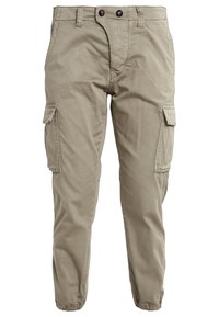 Khaki cargobroek van katoen, met een taps toelopend ontwerp, twee zijzakken en twee voorklepjes. Gestructureerde stof met een zachte afwerking.