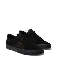 Black sneakers made of suede and canvas, featuring a lace-up design, padded collar, and textured rubber outsole with a logo detail.