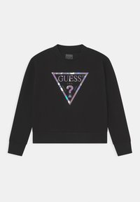Sudadera negra con un logo triangular e irisado de "GUESS" en el centro. Puños y dobladillo acanalados, con un clásico cuello redondo.