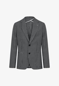Blazer a cuadros en blanco y negro con un corte entallado, solapas de muesca, tres botones y un patrón de tejido texturizado.