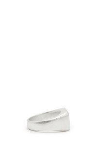 Silver ring with a geometric design, featuring a flat, angled top and a polished finish. Wide band with a smooth inner surface.