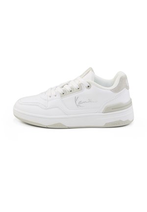 White low-top sneaker with lace-up front, light gray sole and heel accents, and stitched brand logo on side.