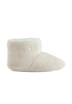 Soft, white, fuzzy boot-style slipper with a high ankle collar and rounded toe, designed for indoor warmth and comfort.