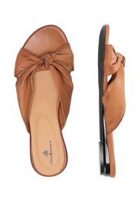 Sandali scivolati in pelle marrone con un design annodato sulla parte anteriore, suola piatta e superficie liscia con minimi dettagli.