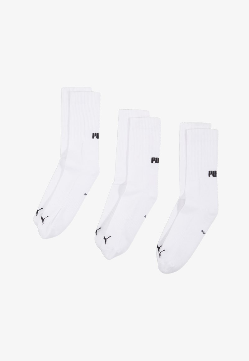 Chaussettes blanches mi-hautes, en mélange de coton, avec logo noir "PUMA" et emblème signature sur la cheville, avec une texture côtelée. Lot de trois.