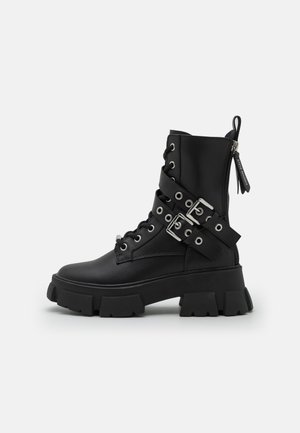 TRACTION - Platform ankle boots - black