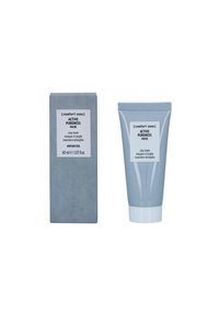 Gray rectangular box with white label and a light gray squeeze tube beside it, both labeled "Active Purity Mask," 60 ml, clay mask.