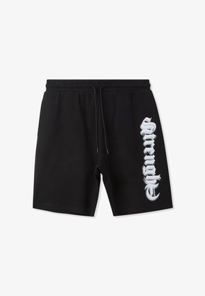 Pantaloni corti neri in cotone con vita elastica e cordoncino, caratterizzati da una grande grafica bianca "forza" stampata verticalmente sulla gamba sinistra.