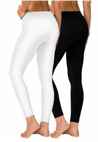 Zwart-witte leggings gemaakt van rekbare stof, met een nauwsluitend ontwerp, een gladde textuur en elastische taillebanden.
