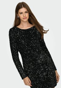 Vestido negro con lentejuelas, mangas largas, escote redondo, con una superficie texturizada y una silueta ajustada.