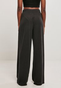 Urban Classics LADIES MODAL WIDE LEG PANTS - Trousers - black