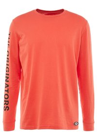 Pomarańczowa koszula z długim rękawem, wykonana z bawełny. Posiada czarny napis "THE ORIGINATORS" wzdłuż lewego rękawa oraz logo na dolnym prawym rogu.