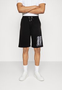 Carlo Colucci UNISEX - Træningsbukser - schwarz