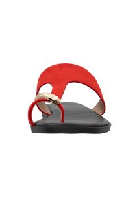 Red suede flat sandals feature a black rubber sole, an open toe design, and a gold accent on the strap, with a smooth texture.