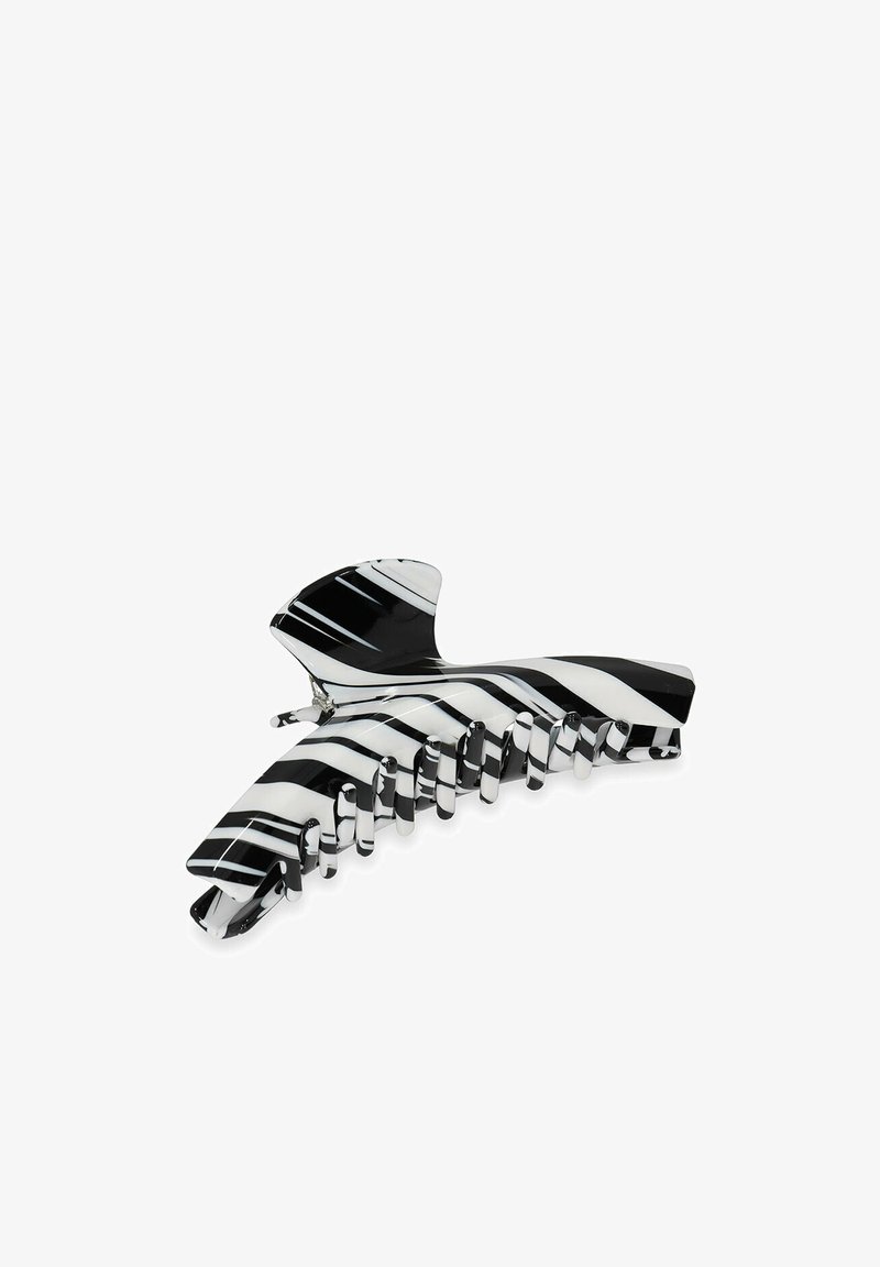 Zwart-witte gestreepte haarklem met een glanzende afwerking, een gebogen bovenkant en meerdere in elkaar grijpende tanden voor een veilige grip.