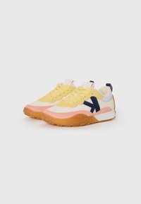Sneakers with a mesh and suede upper, featuring yellow, pink, and light blue panels, a dark blue side logo, and a textured rubber sole.