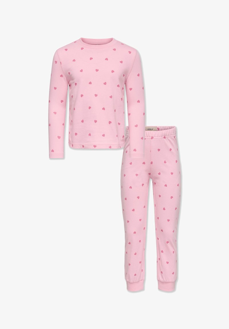 Ροζ μακρυμάνικη μπλούζα και ταιριαστό παντελόνι, και τα δύο με εκτύπωση μικρών καρδιών διάσπαρτες. Μαλακό ύφασμα με ελαστικές μανσέτες και ζώνη μέσης.