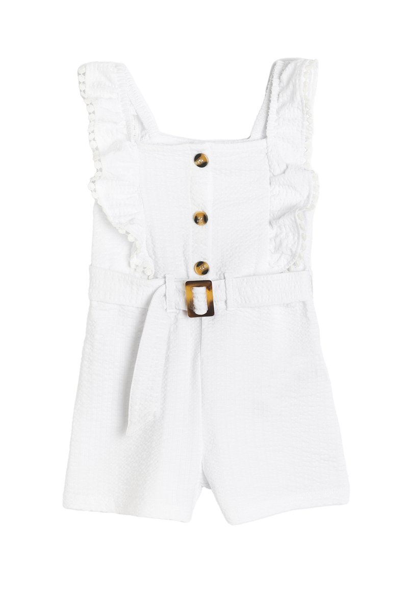 Witte jumpsuit met geruffles schouderbanden, vijf bruine decoratieve knopen en een riem met een schildpadbuckle. Geweven stof.