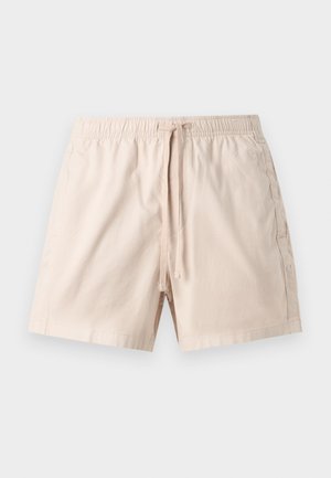 Μπεζ βαμβακερά σορτς με ελαστική μέση και μπροστινό κορδόνι, επίπεδη μπροστινή όψη και ραφές στο πλάι σε μονόχρωμο φόντο.