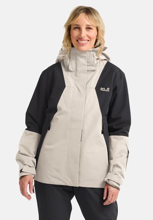 Leichte, wasserdichte Jacke in Beige und Schwarz; hoher Kragen, verstellbare Manschetten, Reißverschlüsse und Logodetail auf der Brust; glatte Textur.
