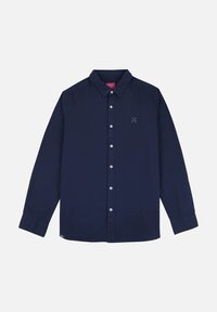 Chemise boutonnée bleu marine en coton. Dotée d'un col classique, de manches longues et d'un petit logo sur la poitrine. Texture lisse.