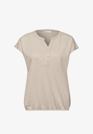 Blusa beige de manga corta con tapeta en escote en V con tres botones y cintura elástica, confeccionada con tela ligera.