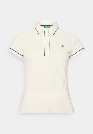 Polo shirt in cream cotton with navy trim, featuring a collared neck, button placket, and a small black logo on the left chest.